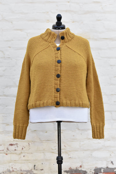 A honey colored knitted cardigan