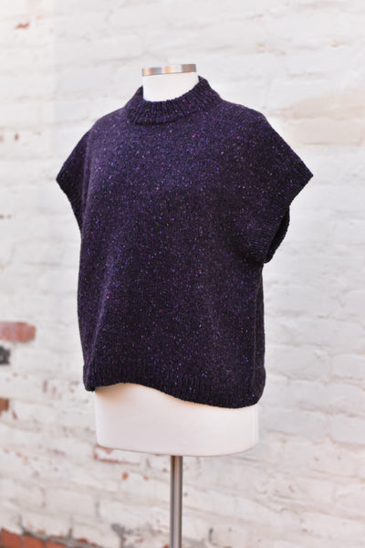 a dark purple knitted sleeveless top
