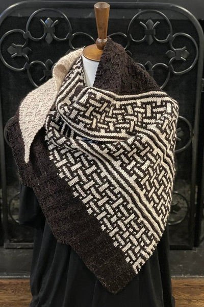 A dark brown and cream lattice patterned knit scarf