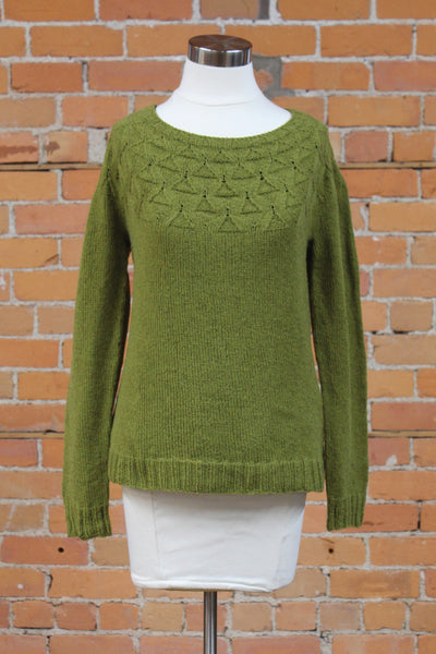 an olive green sweater