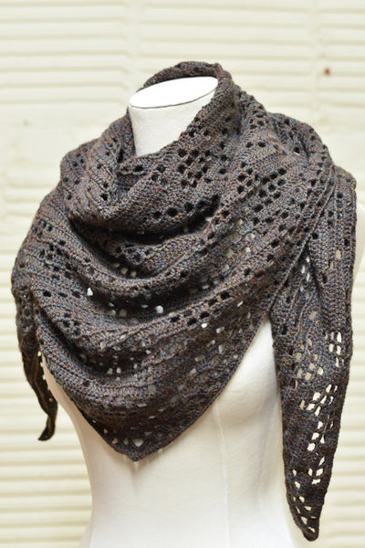 A brown crochet shawl