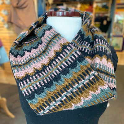 A brown, navy blue, light blue and pink patterned knitted cowl