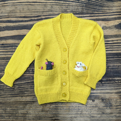 A bright yellow knitted baby cardigan