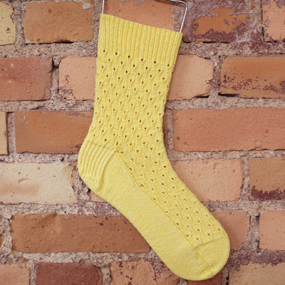 yellow knitted sock